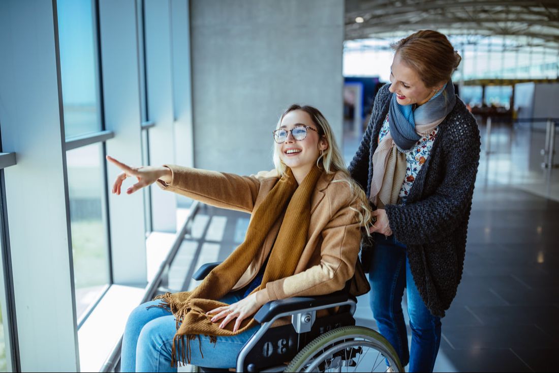 young woman in wheelchair at airport